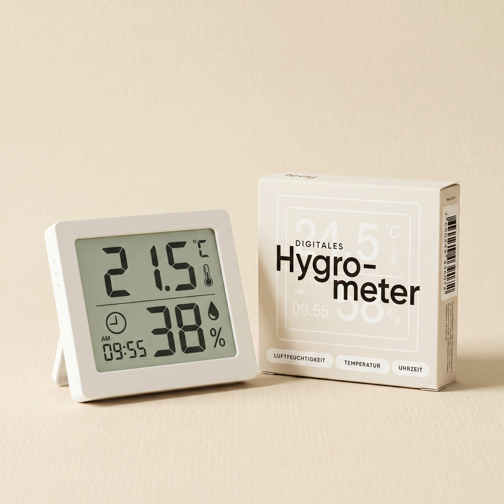 Ein Hygrometer zeigt 21,5°C und 38% Luftfeuchtigkeit - ideal für Zimmerpflanzen - neben seinem weißen 
