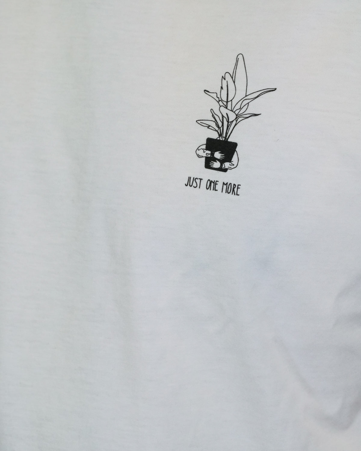 Aufdruck «Just One More» auf dem weissen T-Shirt
