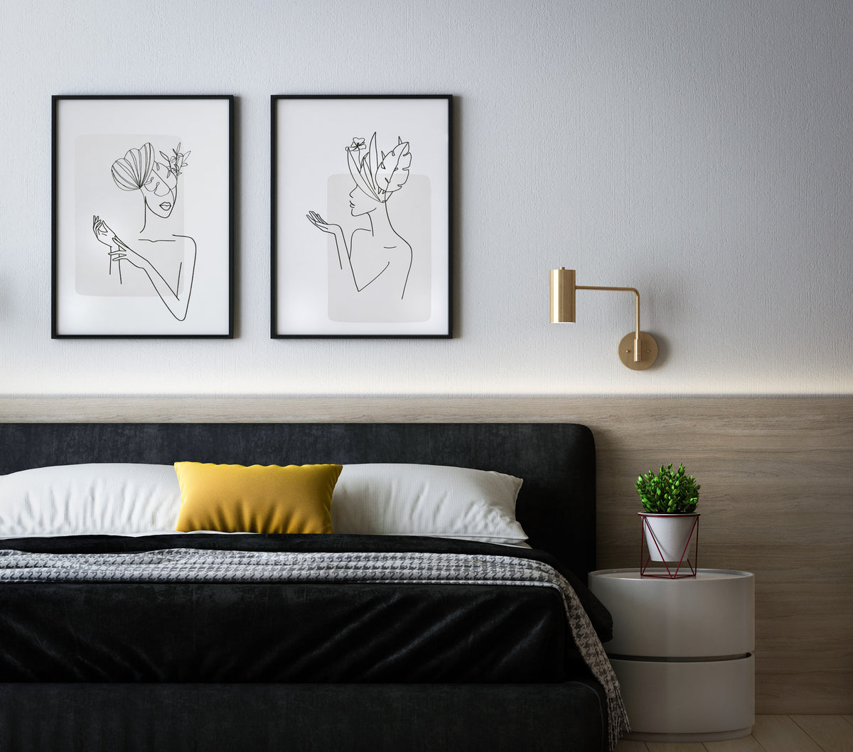 An einer Wand über einem Bett hängen zwei Bilder mit One-Line-Kunst. Neben dem Bett steht eine kleine Pflanze auf einem weissen Nachttisch.